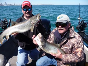 Capt. Steve Everts with a client show off a nice Lake Michigan double. 